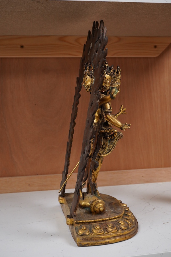 A gilt bronze figure of multi arm Mahakala, 34cm